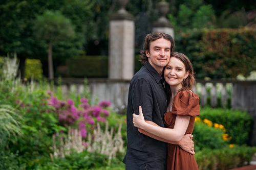  engagement photo with couple smiling at camera