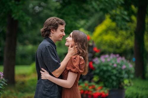 engagement picture where he is holding her face and about to kiss her 