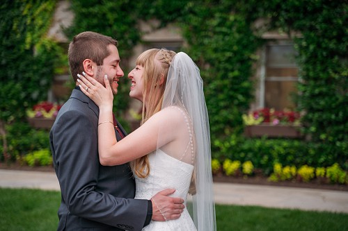 bride touching grooms face