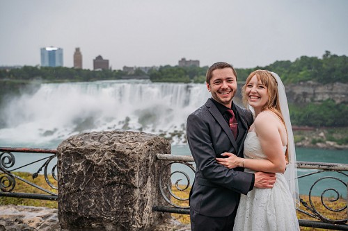 bride and groom portrait in front of American Falls