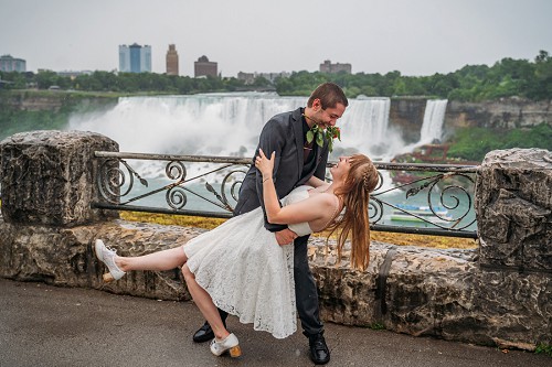 groom dipping bride