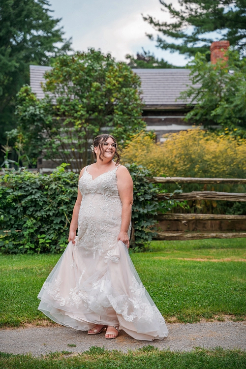 bride playing with her wedding dress 