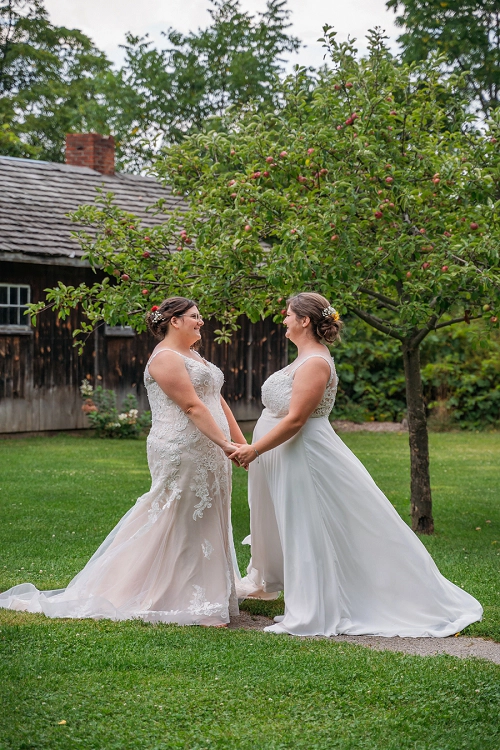 brides holding hands at balls falls 