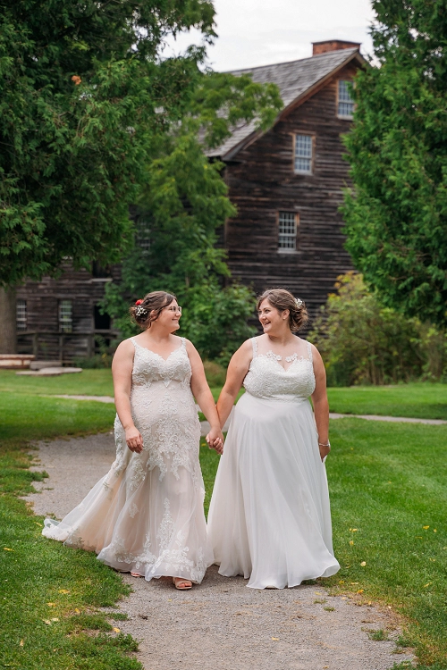 niagara wedding two brides holding hands and walking