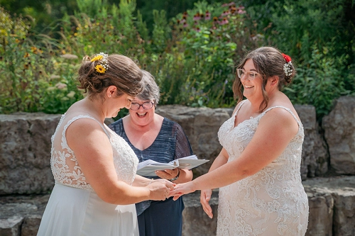 brides laughing during ceremony 