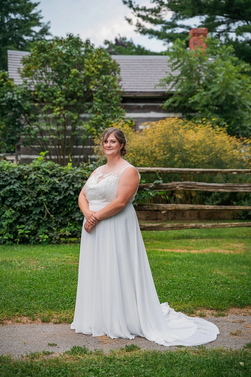 portrait of bride in front of barn