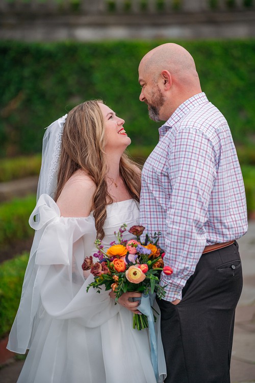 bride and groom laughing