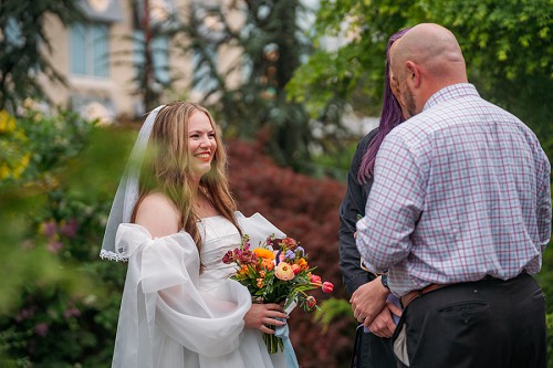 brides laughing during ceremony