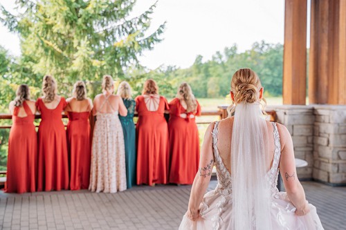 bride walking up to bridesmaids for first reveal