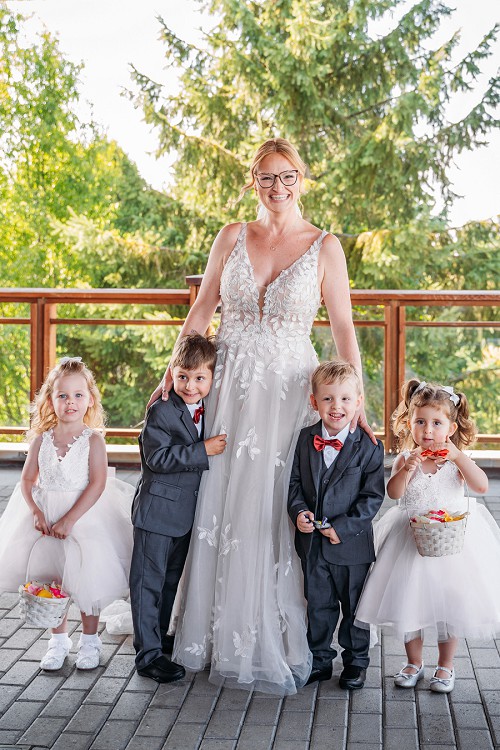 bride with flower girls and ring bearers