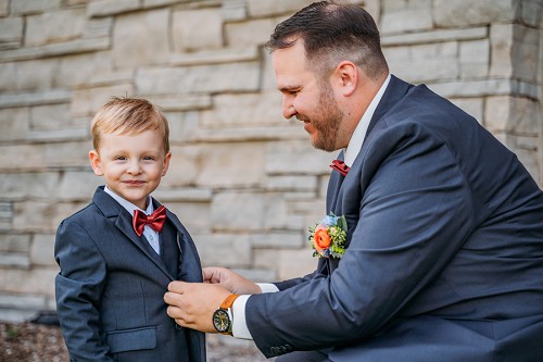 groom dressing his son