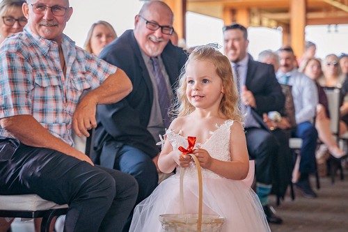 flower girl walking down aisle