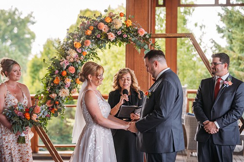 legends niagara wedding ceremony with floral backdrop