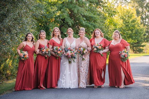 bride smiling with bridesmaids