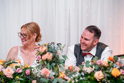 bride and groom laughing