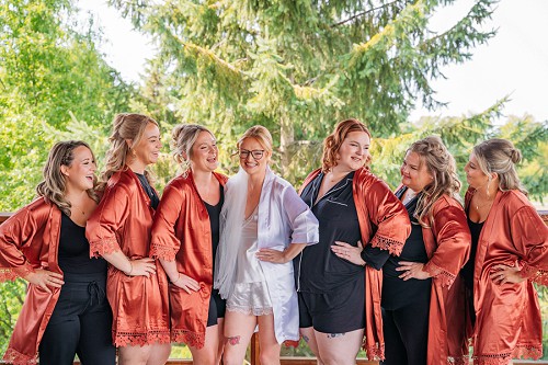 bridesmaids in robes laughing