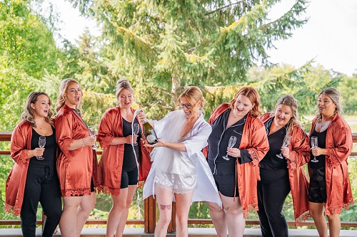 champagne toast with bridesmaids