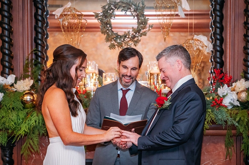 intimate wedding ceremony in front of fireplace at Prince of Wales hotel 