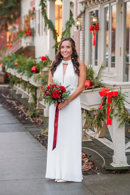 bridal portrait in front of Prince of Wales hotel with christmas decorations 