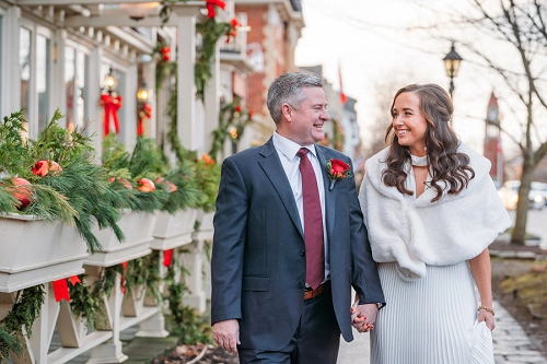 bride and groom walking on king st in niagara on the lake