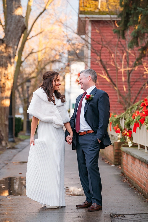  bride smiling at groom during winter in niagara on the lake