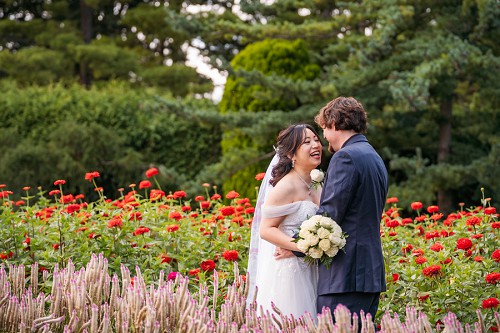 bride and groom in sea of flowers