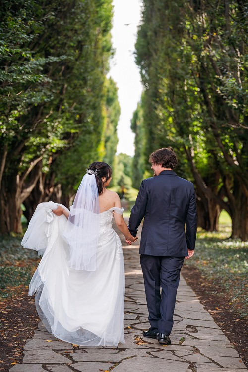 bride and groom walking from behind