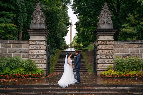 bride and groom on stairs at Brocks Monument