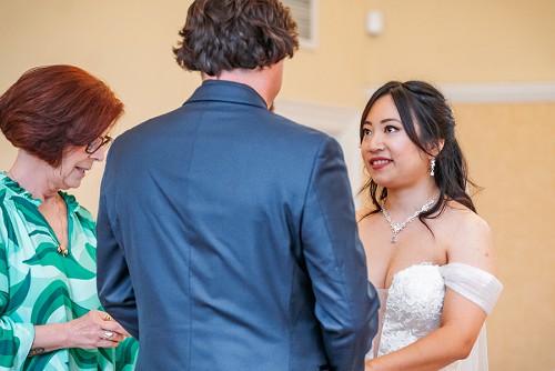 bride smiling at groom 