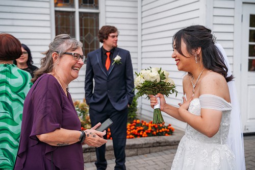 bride laughing with guests