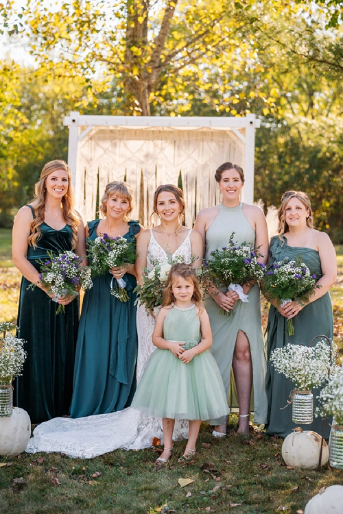  bridesmaids smiling with bride