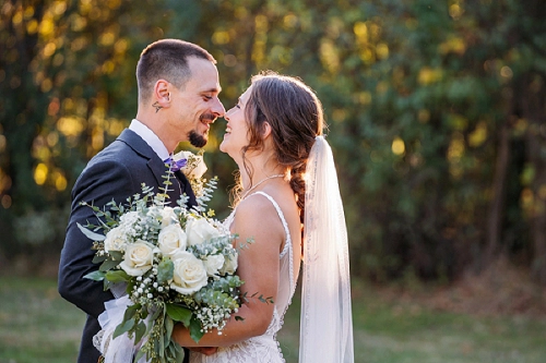 bride and groom laughing together 