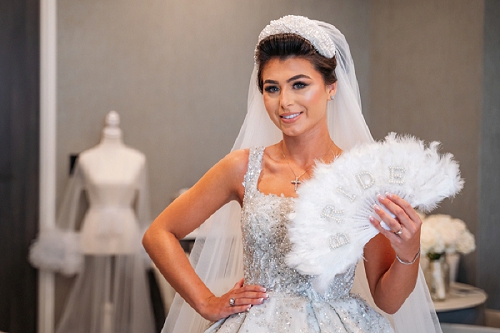  bride smiling with fan