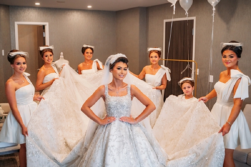 bridesmaids helping bride get ready 