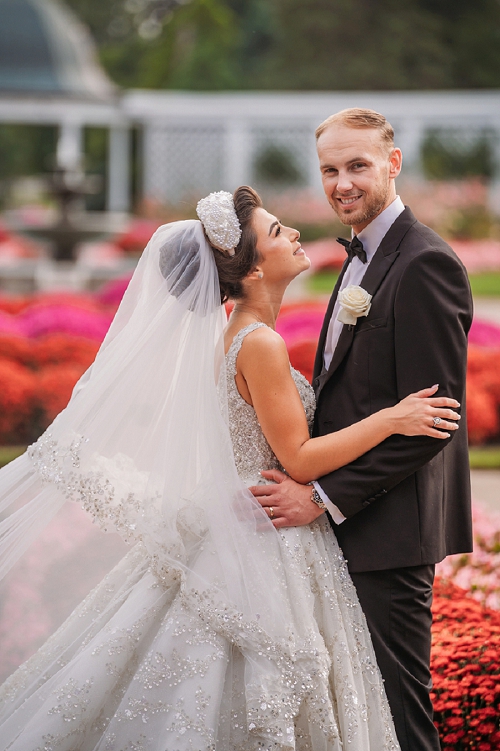 bride smiling at groom 