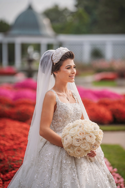 bride smiling in rose garden 