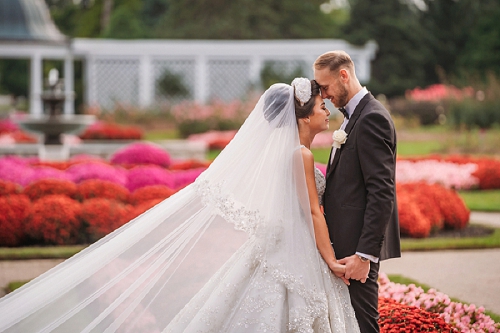  bride and groom surrounded by flowers