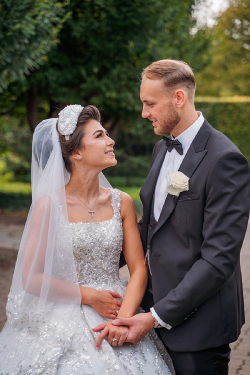  bride and groom holding hands