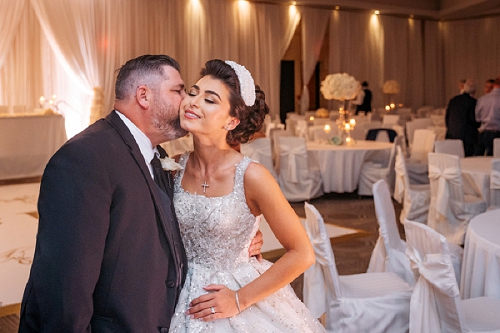 bride and father embracing 