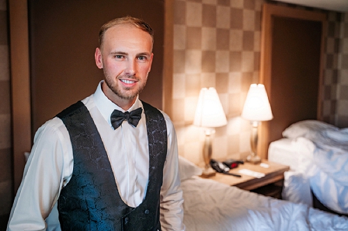  groom portrait in hotel room